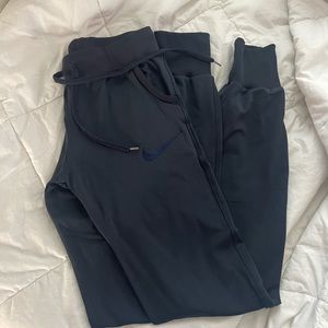Nike kids navy blue joggers in size L